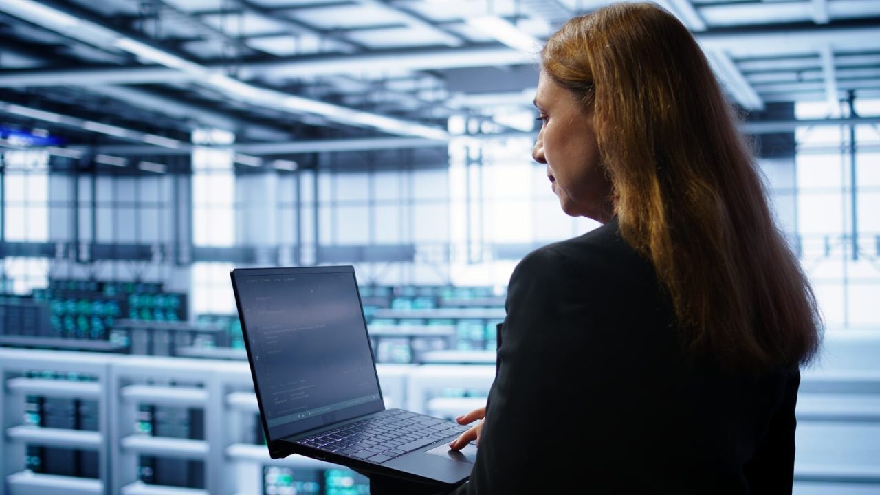 System administrator running error checks on a laptop