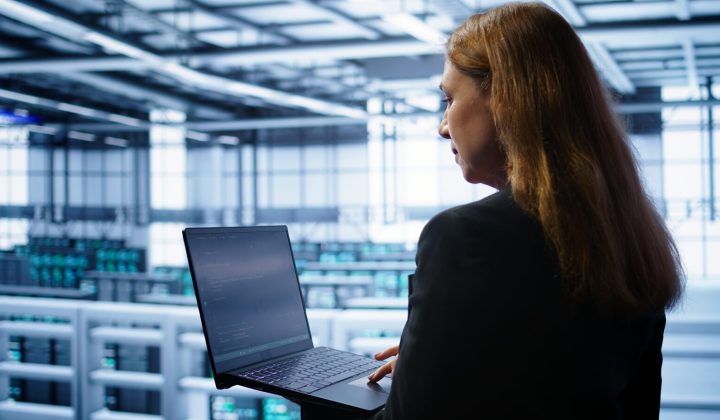 System administrator running error checks on a laptop